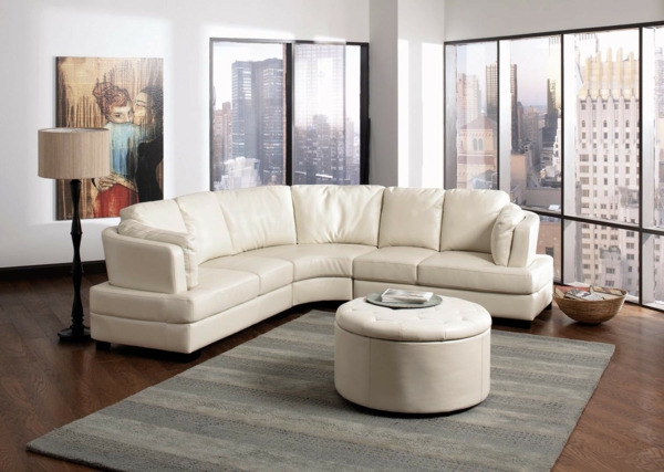 living-room-furniture-cool-apartment-living-room-with-white-leather-round-sectional-sofa-and-handpainting-canvas-wall-art-also-black-window-frames-astonishing-round-sectional-sofa-design