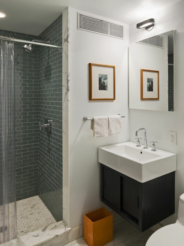 badezimmer design mit  graunen fliesen und bild mit rahmen