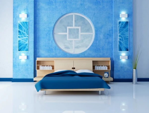 blaues schlafzimmer mit einem kreis an der wand als dekoration