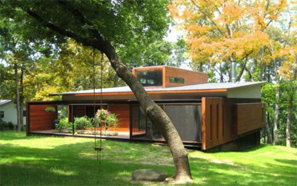 kleines-haus-bauen-mit-schöner-grünen-umgebung - flaches dach