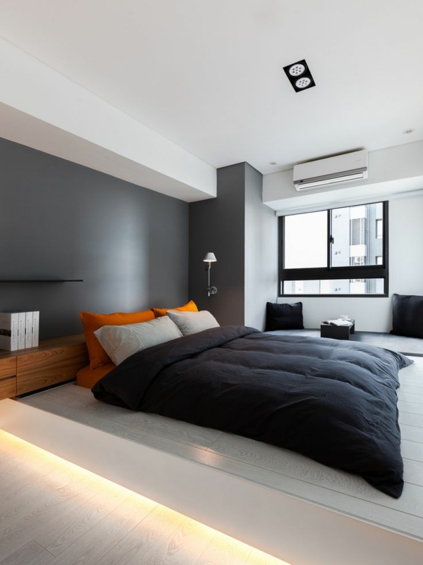 schlafzimmer-modern-gestalten-graue-wand-hinter-dem-bequemen-bett