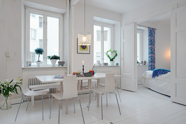 ultramodern-dining-room-white-wall-doors-chandelier-chairs