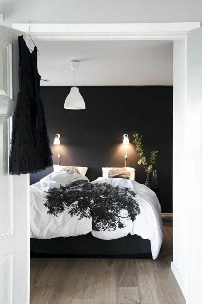Schlafzimmer-norwegisches-Design-extravagant-schwarze-Wand-Kleid-weiße-Bettwäsche-schwarzer-Akzent