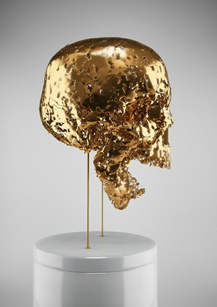 moderne-Skulptur-goldener-Schädel