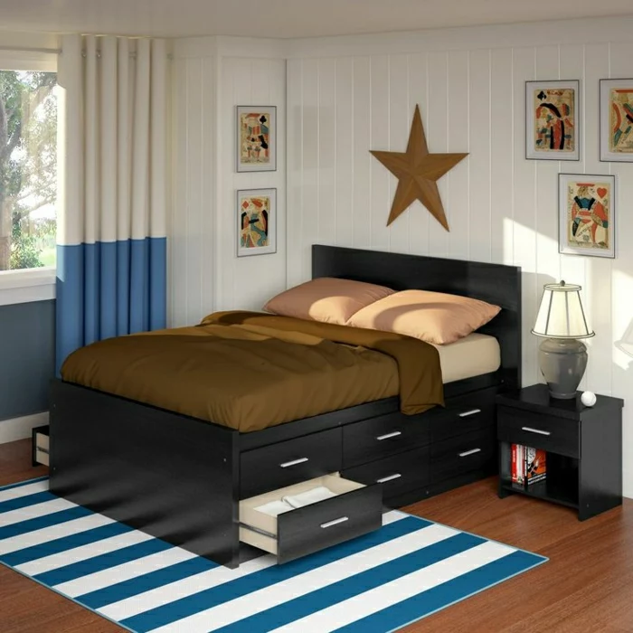 Schlafzimmer-Bett-Schubladen-gestreifter-Teppich-zweifarbige-Gardinen-Stern-Dekoration-Nachttisch-Bilder-Art
