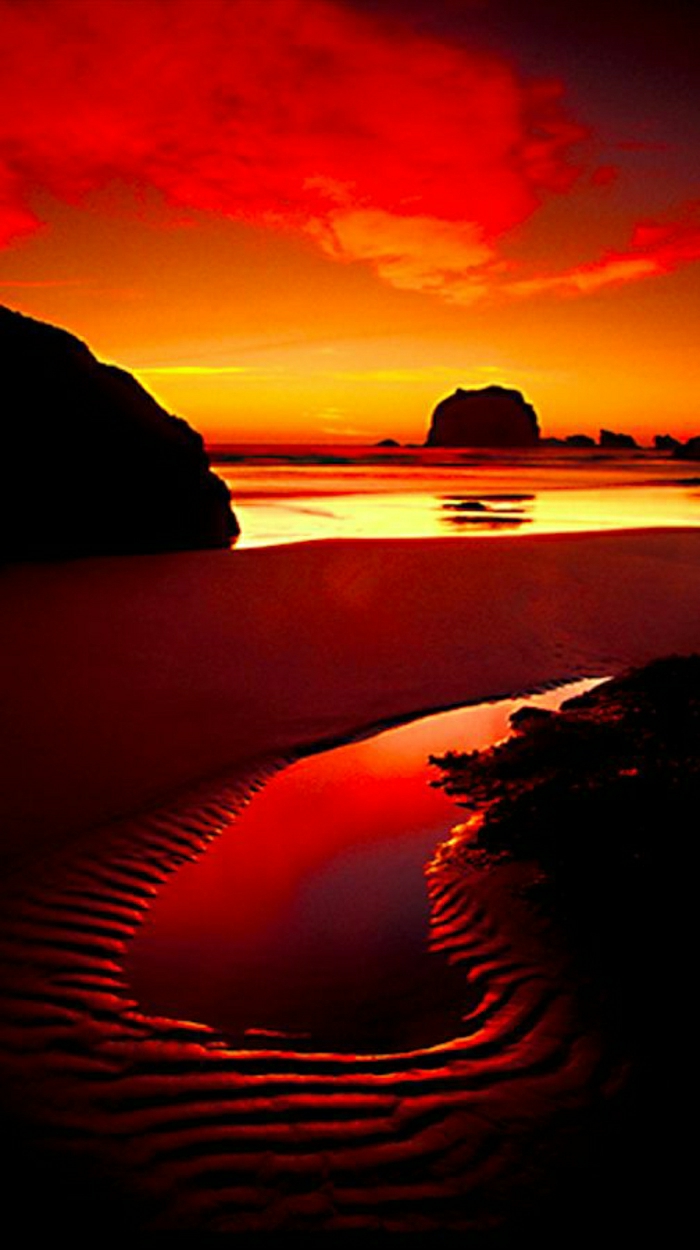 Sonnenuntergang-Wasser-Haystack-Rock-Cannon-Beach-Oregon-Nordküste