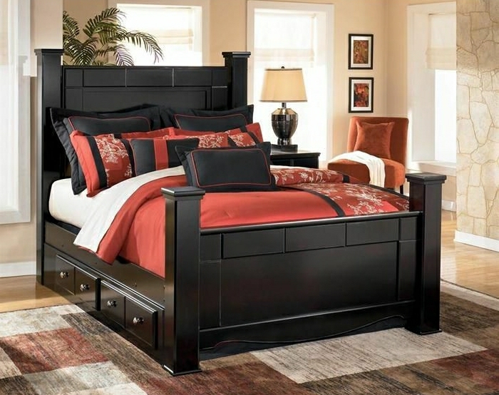 elegantes-Schlafzimmer-Bett-mit-Schubladen-Bettwäsche-rot-beige-schwarz-Steinwand-Bilder-Pflanze