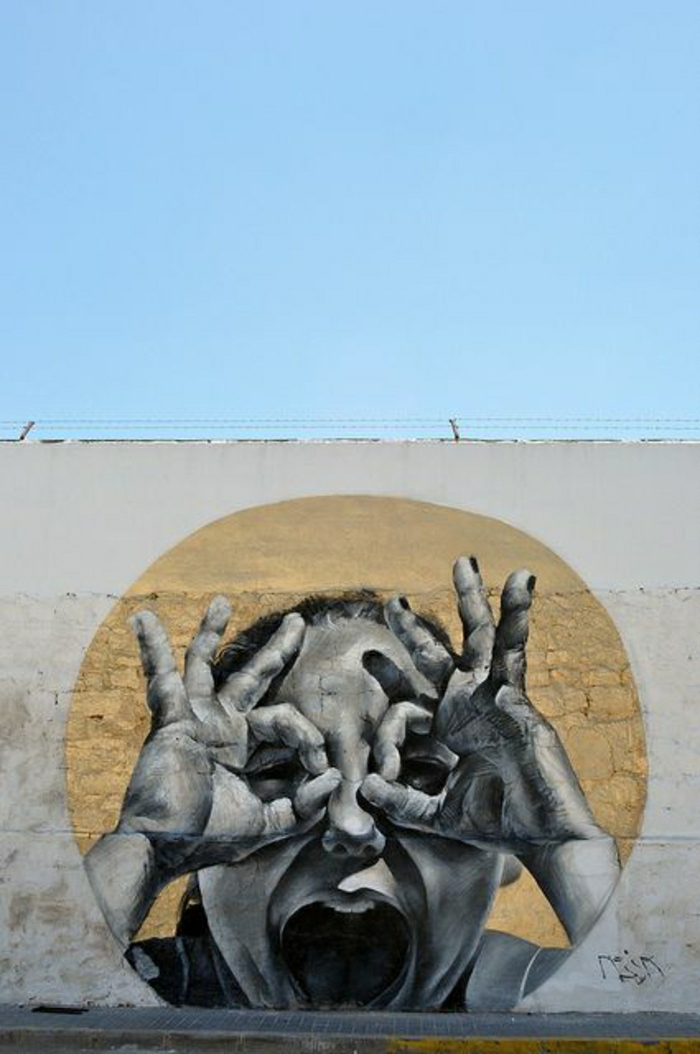 Wand-Himmer-Graffiti-Kind-Hände-Augen-lustiges-Zeichen-Mesa-Spanien