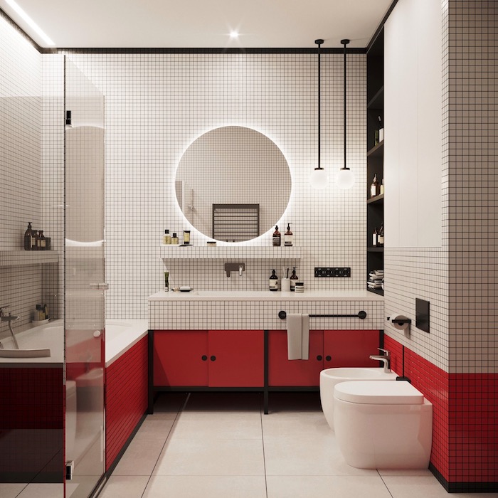Bad Einrichtung in Weiß und Rot, runder Spiegel, rote Schränke und Glastür 