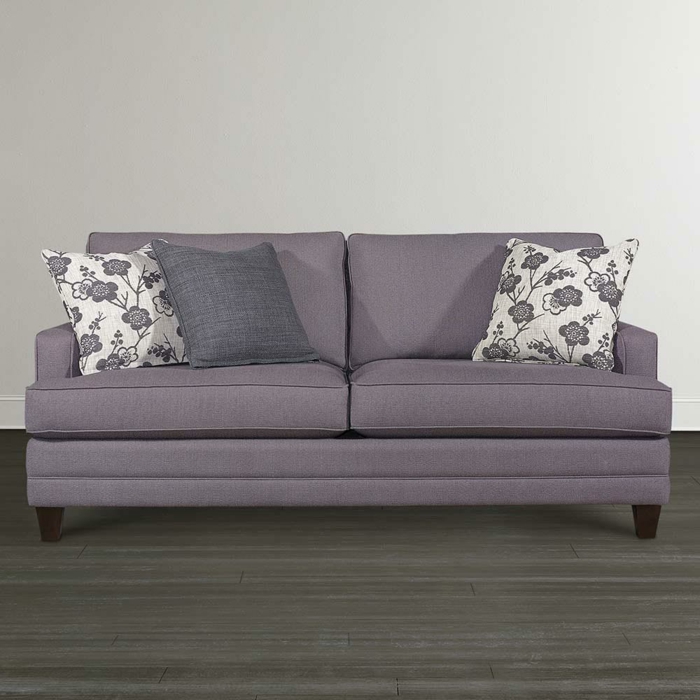 graues-Sofa-Textil-bunte-Kissen-schlichtes-Interieur