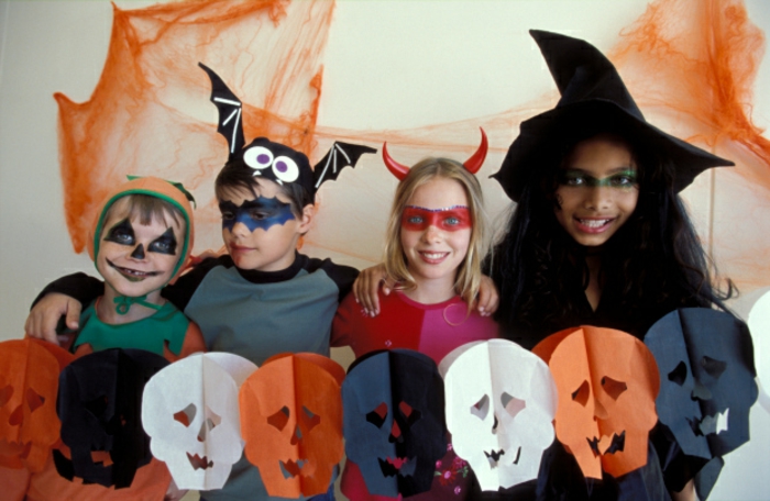 Portrait of children dressed up Halloween costumes