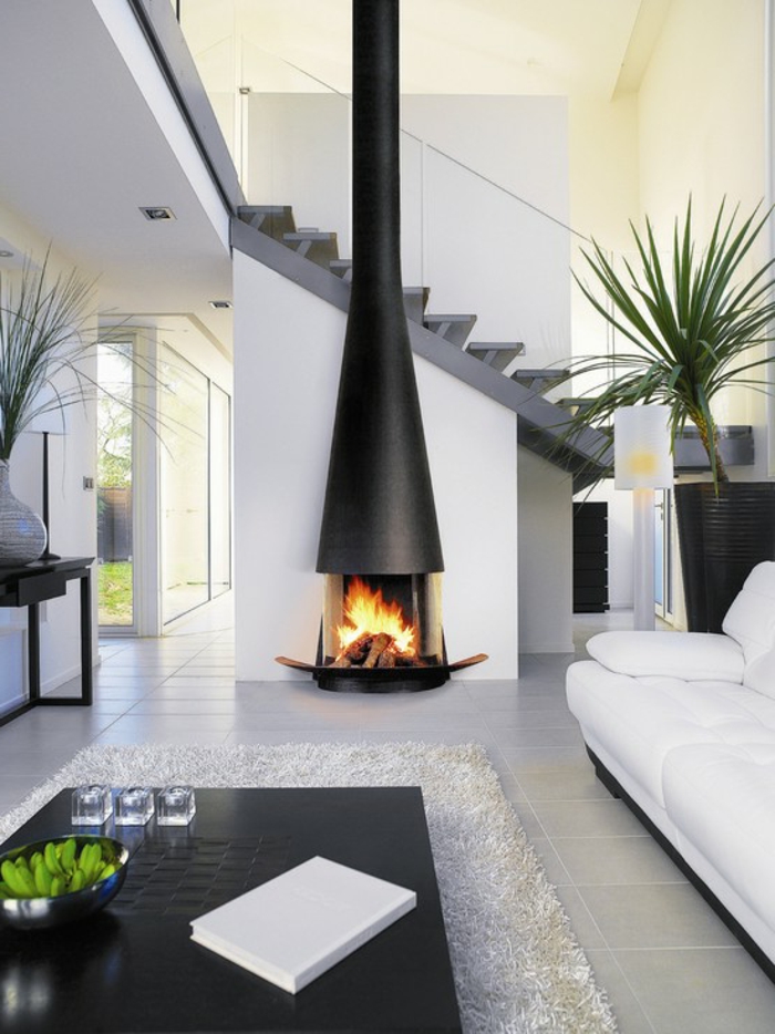 minimalistisches-Interieur-elegante-Gestaltung-Treppen-Kamin-modernes-Design-weißer-Teppich