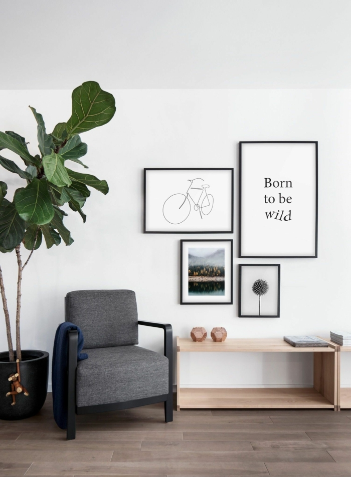 Linienzeichnung von einem Fahrrad, inspirierendes Zitat, kleiner Sessel in grau, große Pflanze, Bilder mit Rahmen