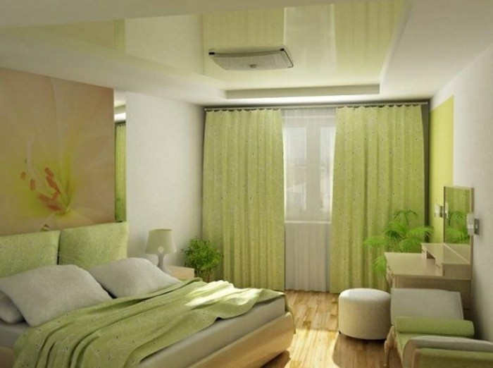 wandfarbe-grün-interessante-garderobe-kissen-auf-dem-bett-im-schlafzimmer