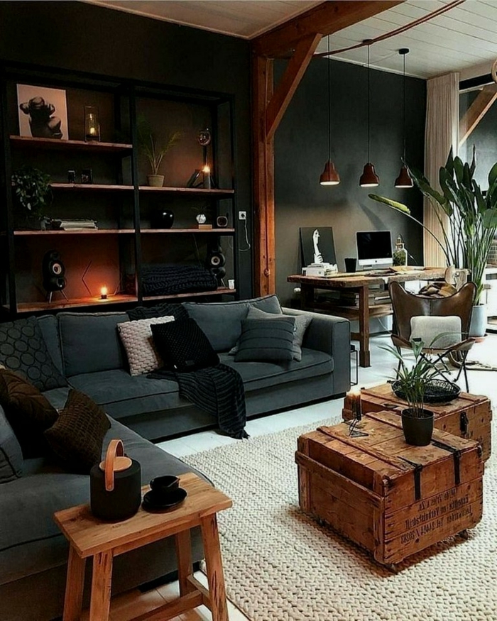 Industrial chic Stil der Wohnung, sichtbare Balken, Kisten als Tische, Pflanzen, Wohnzimmereinrichtungen, Lampen aus Metall