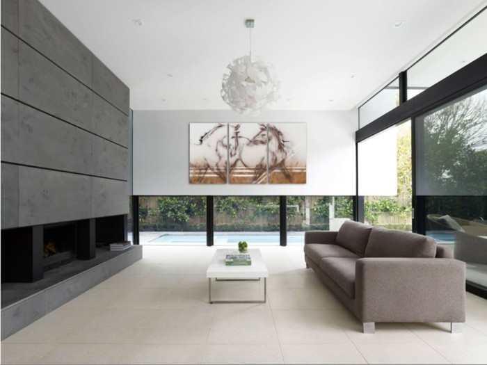 leinwandbild-pferde-luxurioses-wohnzimmer-feuerstelle-glaswande-simpeleingerichtet
