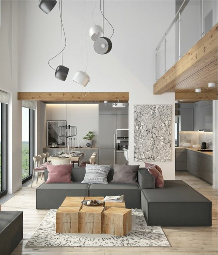 moderne-einrichtungsideen-wohnzimmer-holztisch-plueschteppich-graue-eckcouch-uebergang-zur-kueche