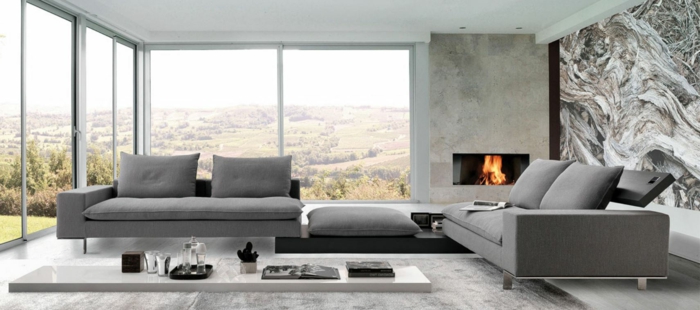moderne-italienische-moebel-wohnzimmer-feuerstelle-ausziehmoebel-weisser-holzboden-grauer-plueschteppich