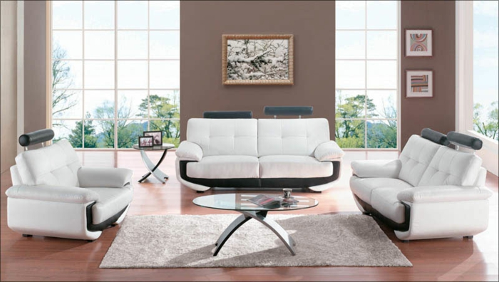 moderne-moebel-ausziehmoebel-wohnzimmer-glastisch-ovale-form-holzboden-plueschteppich-ledermoebel