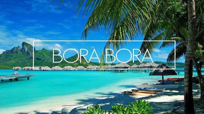 blaues meer blauer himmer bild von bora bora insel palmen sand strand gebirge häuser im wasser