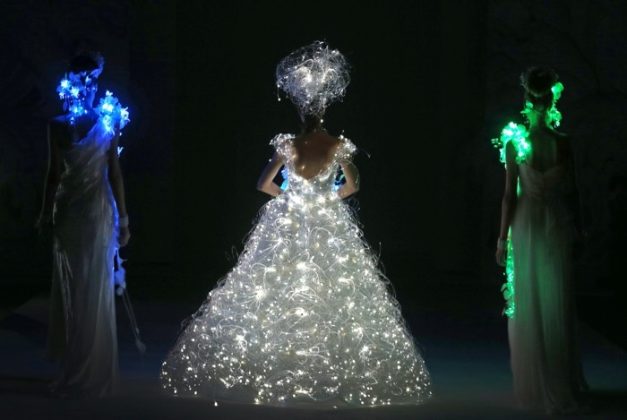 A model showcases a wedding dress that lights up by Japanese designer Yumi Katsura on Wednesday Nov. 28, 2012 in Singapore during the Japan Couture 2012 Singapore fashion show.(AP Photo/Wong Maye-E)