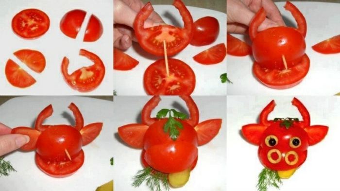 Teller-Dekoration mit Tomaten, Käse, Dill und Petersilie