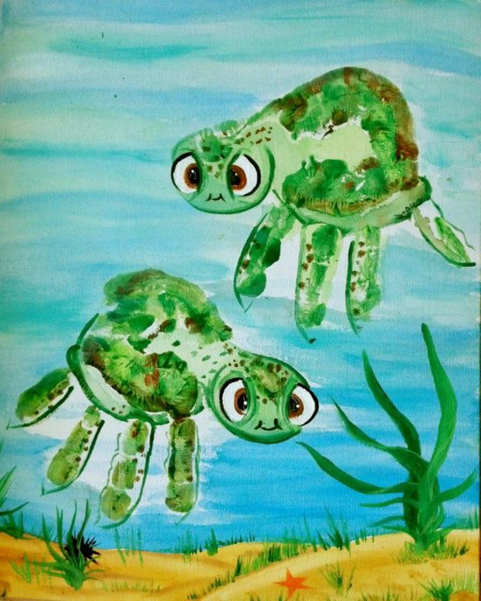zwei schöne grüne schildkröten - bild mit handabdruck 