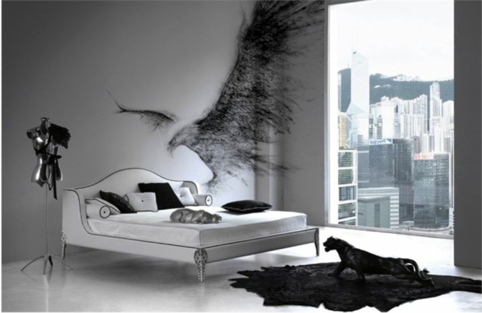 modernes Gothic-Schlafzimmer mit weißem Doppelbett, Wand-Graffiti, schwarzer Teppich, schwarze Puma