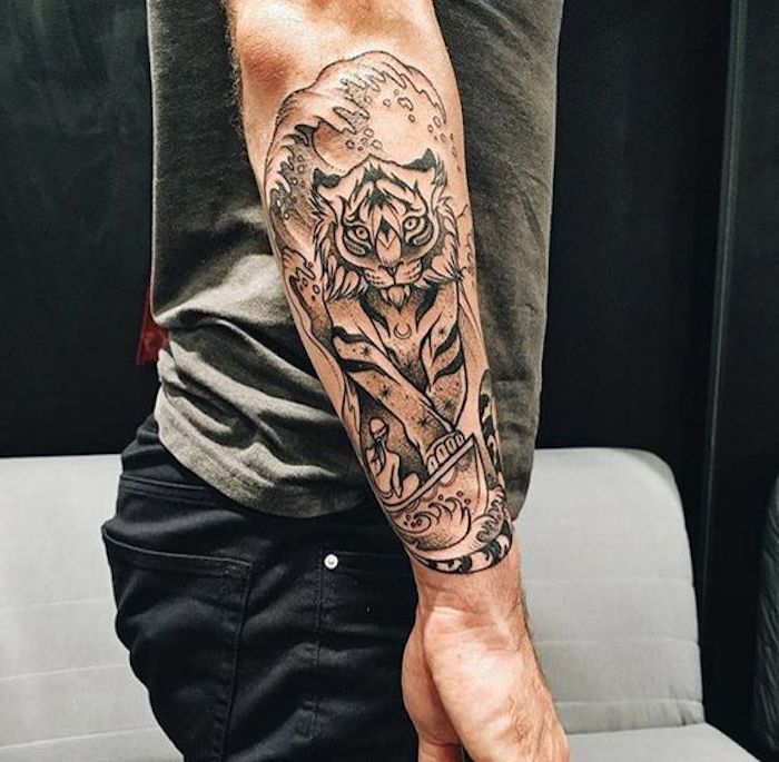 Bedeutung mann arm tattoo John McAfee's