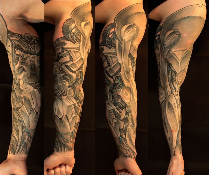 schwarze-graues biomechanik tattoo am arm, tattoos für männer
