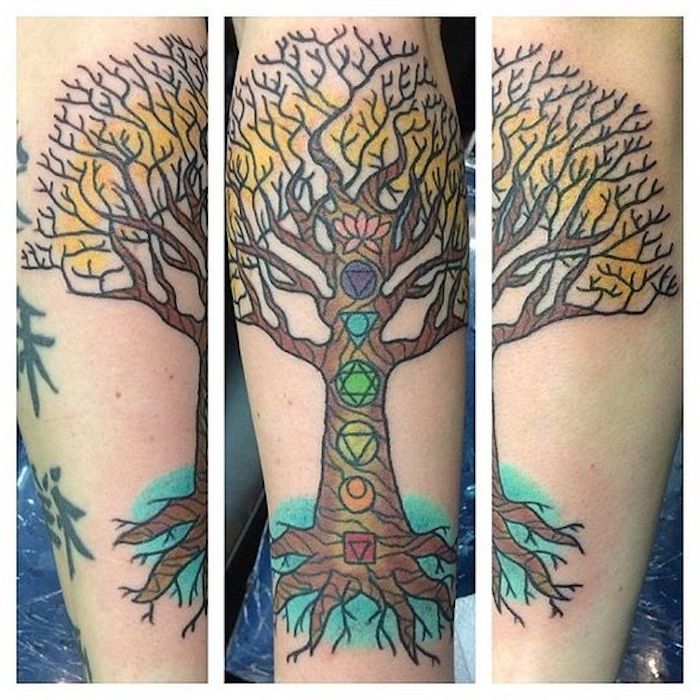 ein Lebensbaum Tattoo mit verschiedenen Symbole aufeinander geordnet