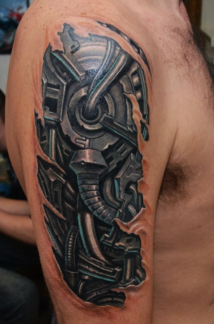tattoos oberarm, schwarz-graue tätowierung im 3d-look am schulter, biomechanik tattoo oberarm 