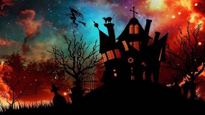 eine Kirche und eine Hexe die am Besen fliegt über den Friedhof - Bilder Halloween