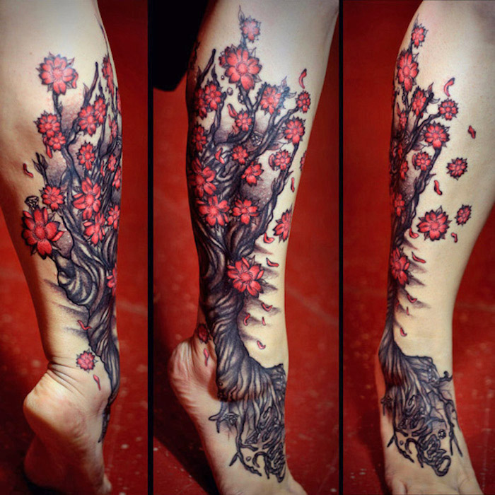 tattoo beudetung, baum mit roten blüten, tattoo mit kirschbaum-motiv am bein