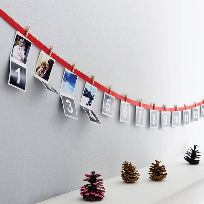 Adventskalender basteln für Männer - Nummer und Fotos hängen von einem roten Band