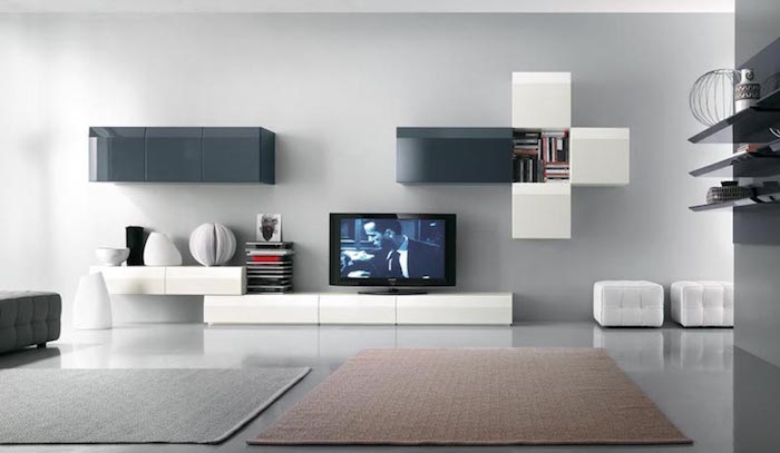 tv wandpaneel grau weiß und blau farben an der wand wandgestaltungsideen weiße regale schubladen deko