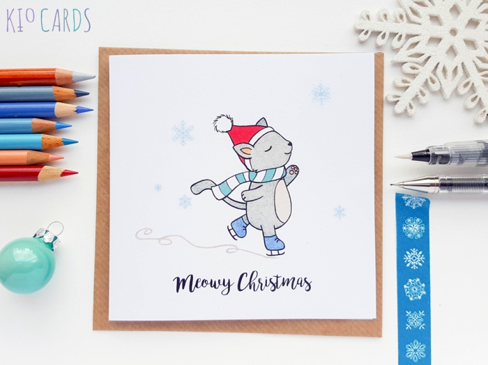Süße Weihnachtskarte für Kinder, Kätzchen mit Weihnachtsmütze und Schal läuft Schlittschuh