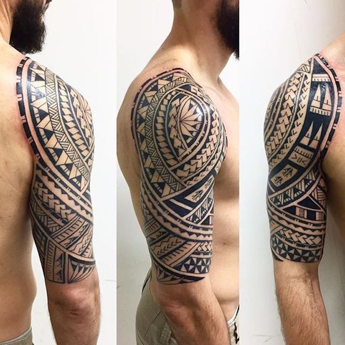 maori tattoo arm - ein junger mann mit einem bart und mit einer hand mit einem großen schwarzen maori tattoo