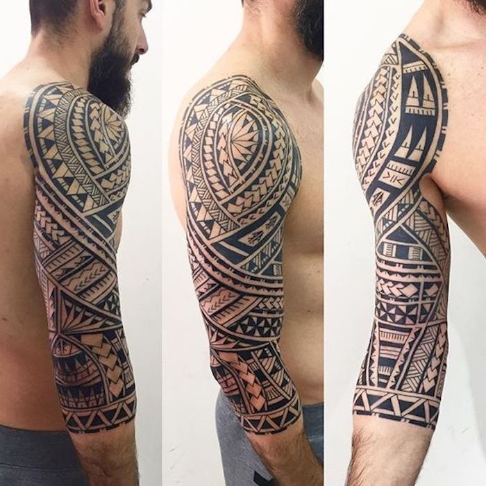 ein junger mann mit grauen hosen und bart und einem großen schwarzen maorie tattoo