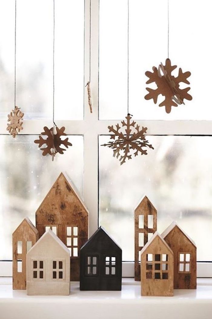 weihnachtsfensterdeko sterne und schneeflocken fliegen über die häuser holzhaus figuren deko
