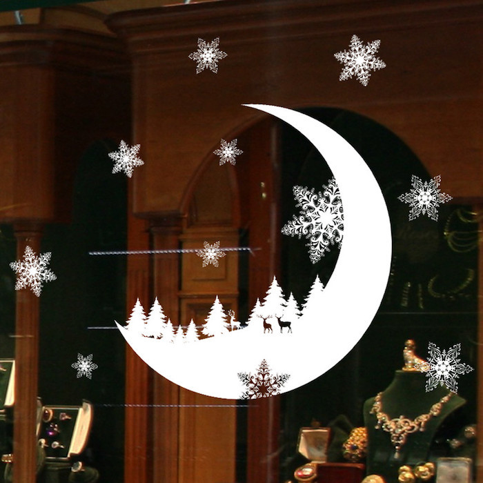 weihnachtsbeleuchtung fenster mond deko sticker für fenster schneeflocken aufgeklebt am fenster