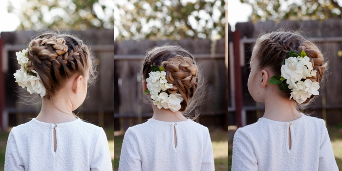 Kinderfrisuren, ein blondes Mädchen mit Dutt, weiße Blumen als Haarschmuck