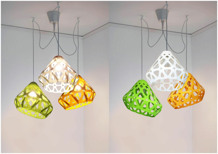 bunte Lampenschirme aus Plastik in drei Farben - weiß, grün und gelb