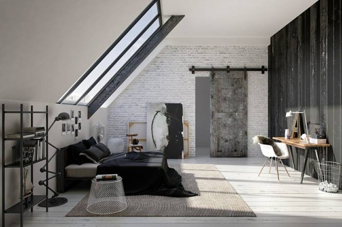 ein graues Schlafzimmer im Dachgeschoss Wohnung, graue Wand, Bachstein Optik Wand