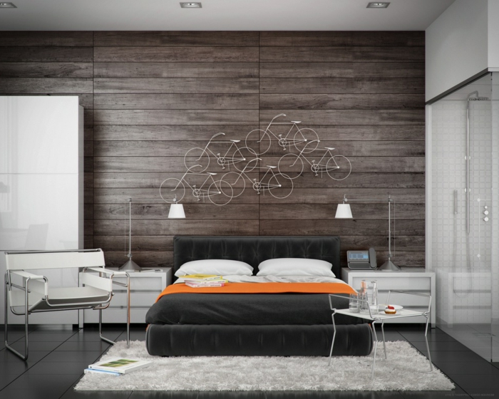 kreative Schlafzimmer Deko mit kleinen Fahrräden, weißer Stuhl, Wand in Naturholz Optik
