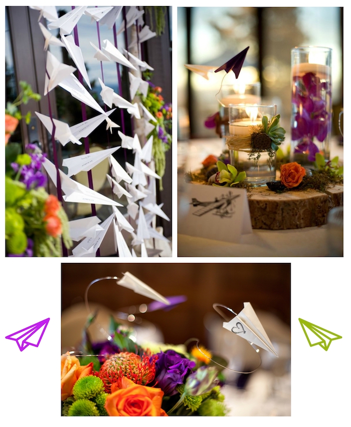 ein tisch mit deko mit kerzen, kleinen grünen, violetten und orangen pflanzen und holz und kleinen weißen und violetten papierfliegern