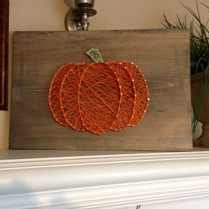 eine orange Fadengrafik Anleitung, ein Kürbis, eine perfekte Dekoration zu Halloween