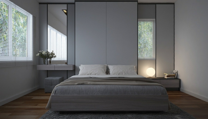 Schlafzimmer grau gestalten, zwei Spiegel und eine runde Lampe, graues Bett