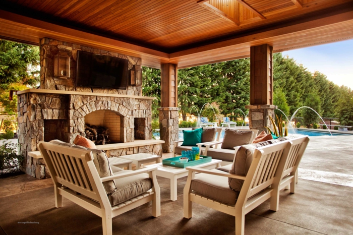garten terrasse mit pool und barbeque, sitzecke für gäste und familie kaminofen