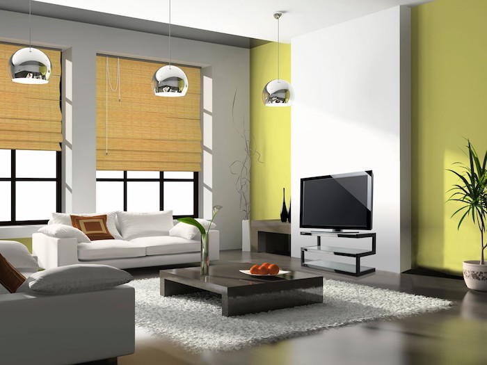 wohnzimmer deko ideen, grüner wand als farbakzent, kleines weißes sofa, flauschiger teppich